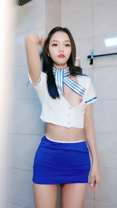 Woman seduction before taking shower with uniform 