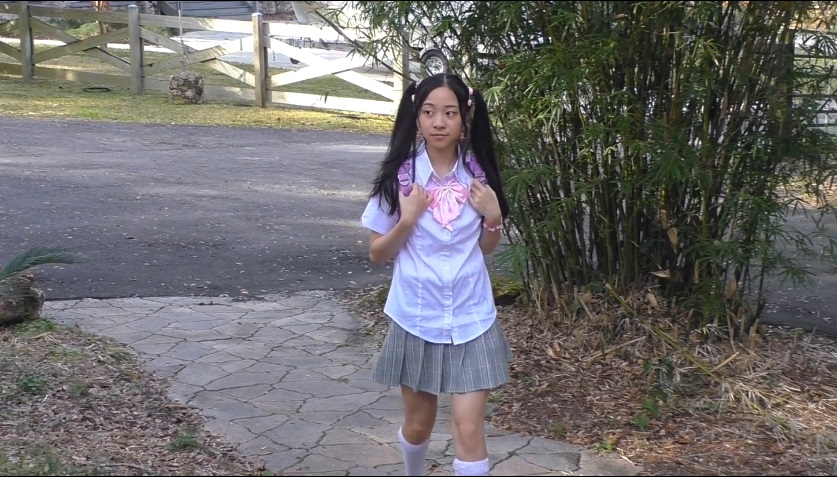 Cute school girl with double ponytails was punished by teacher 